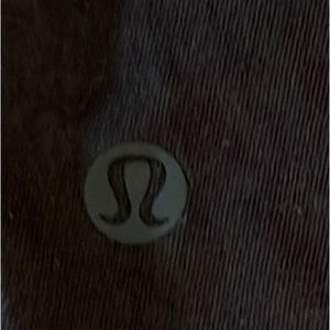 lululemon short sleeve Pima cotton black top. It has a flattering knot on front!